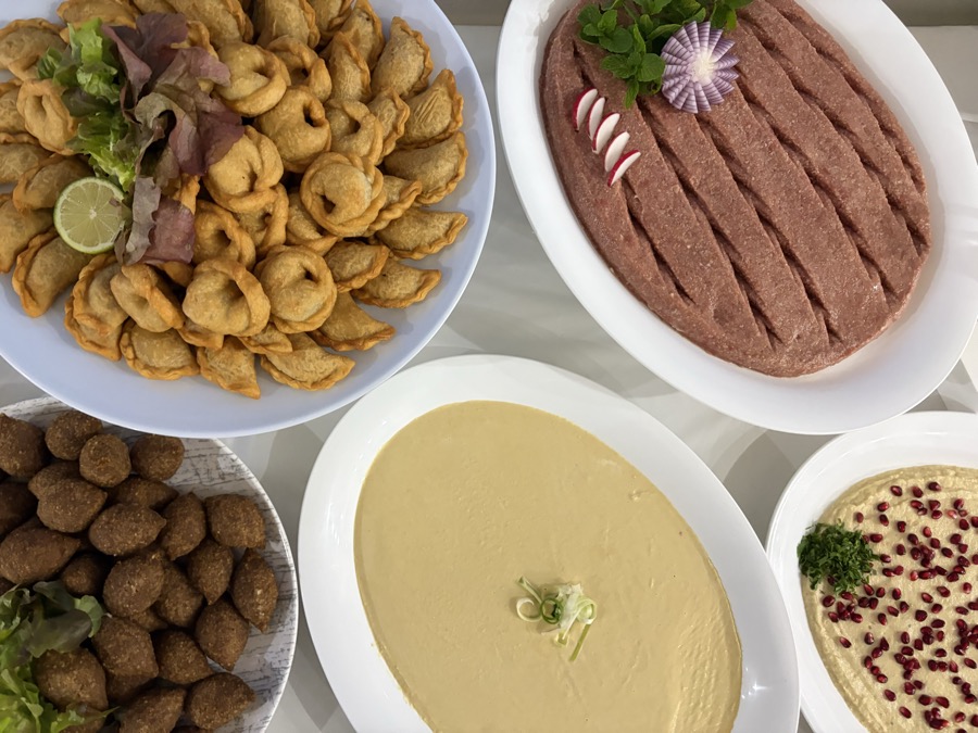 Kibbeh nayeh, sambousik, hummus and kibbeh spread
